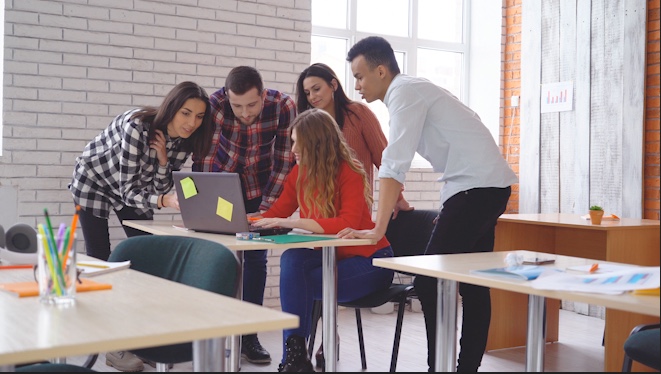 A group of teens collaborating