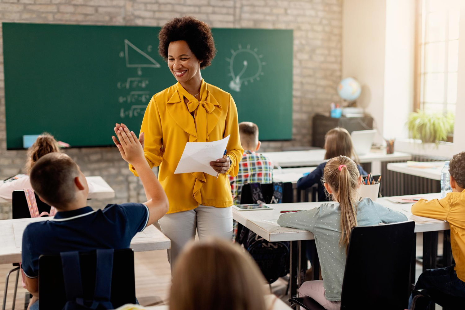 Supportive teacher Teacher congratulates student on test.